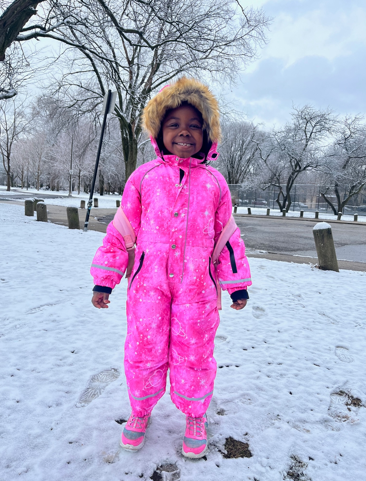 A47C5BD6-0CFF-496F-9E3D-F397E2E31604 girl posing in snowsuit