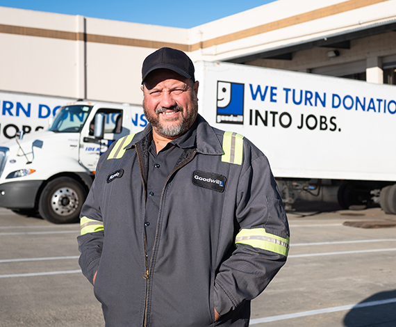 man in front of goodwill truck