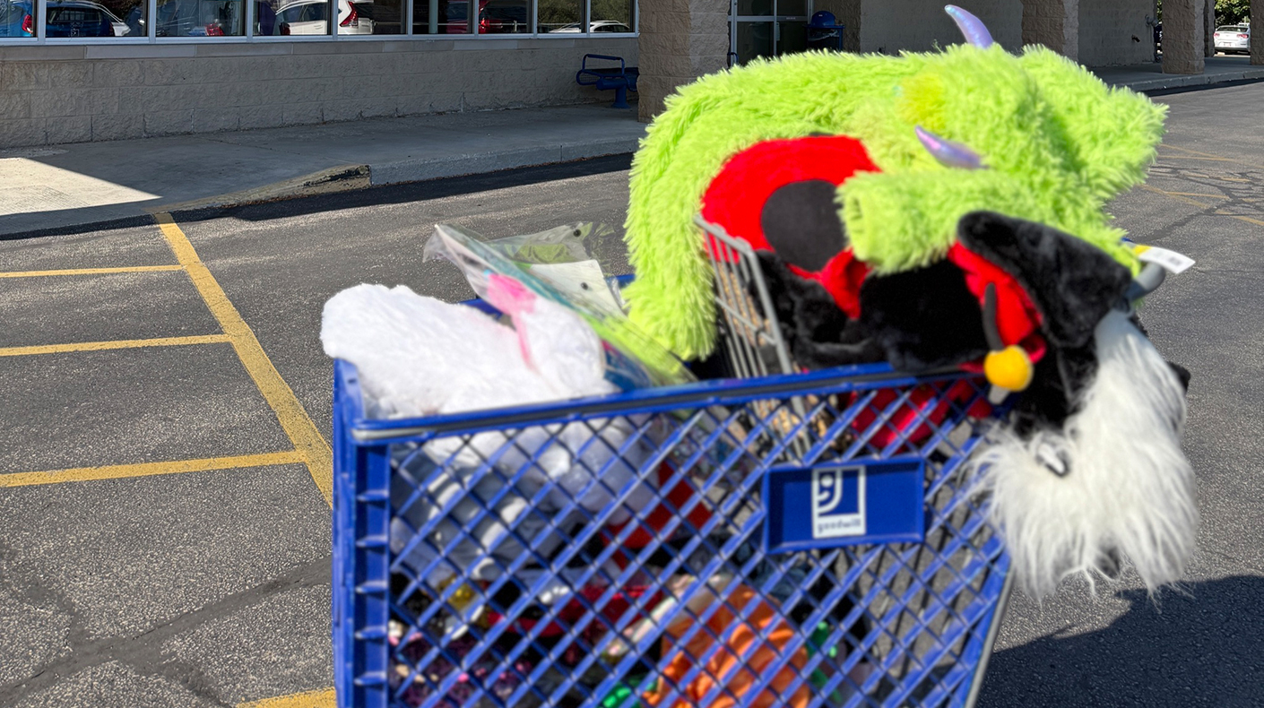 Goodwill cart with Halloween costumes inside of it