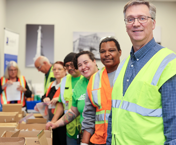 line of workers in vests