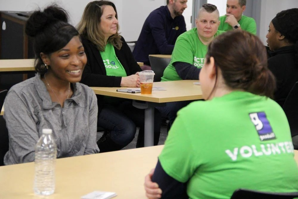 Goodwill volunteer at high school mentoring event