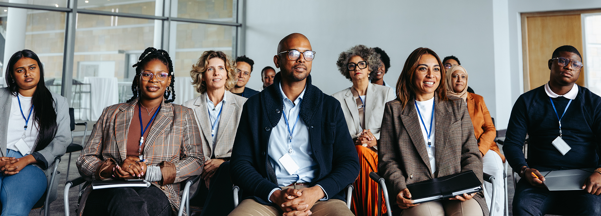 group of people listening to a speaker
