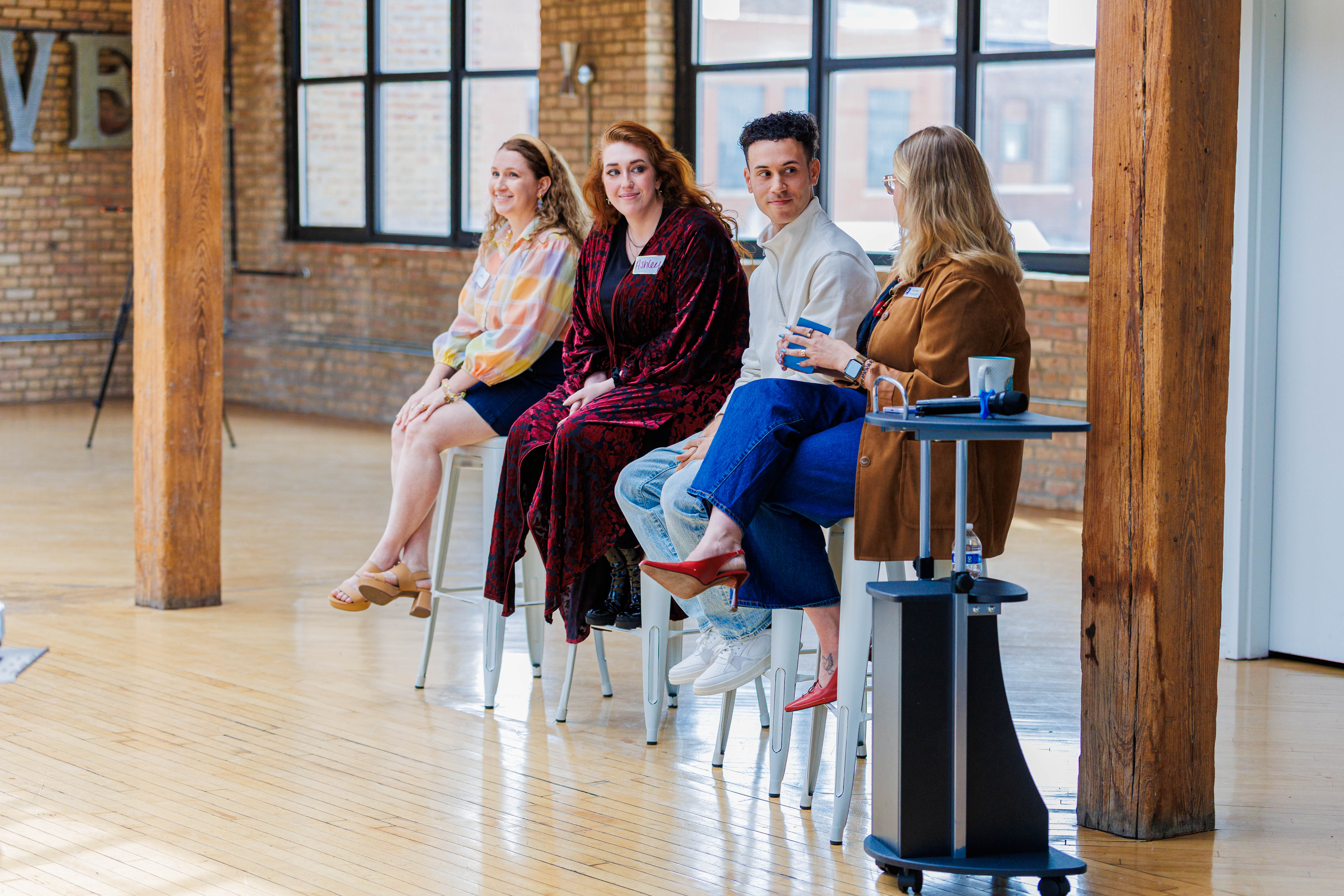 Goodwill of Greater Milwaukee & Chicago hosted its first ever Creator Summit by Second Chance Studio People sitting on stools speaking on a panel