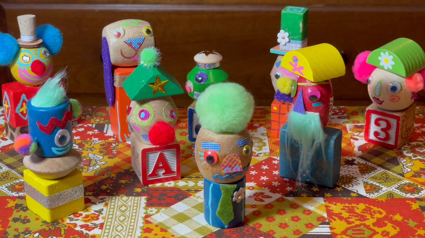 Various toy blocks upcycled to be fun and colorful characters