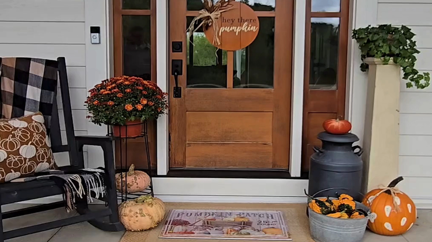 A stunning fall porch with various upcycled and thrifted items