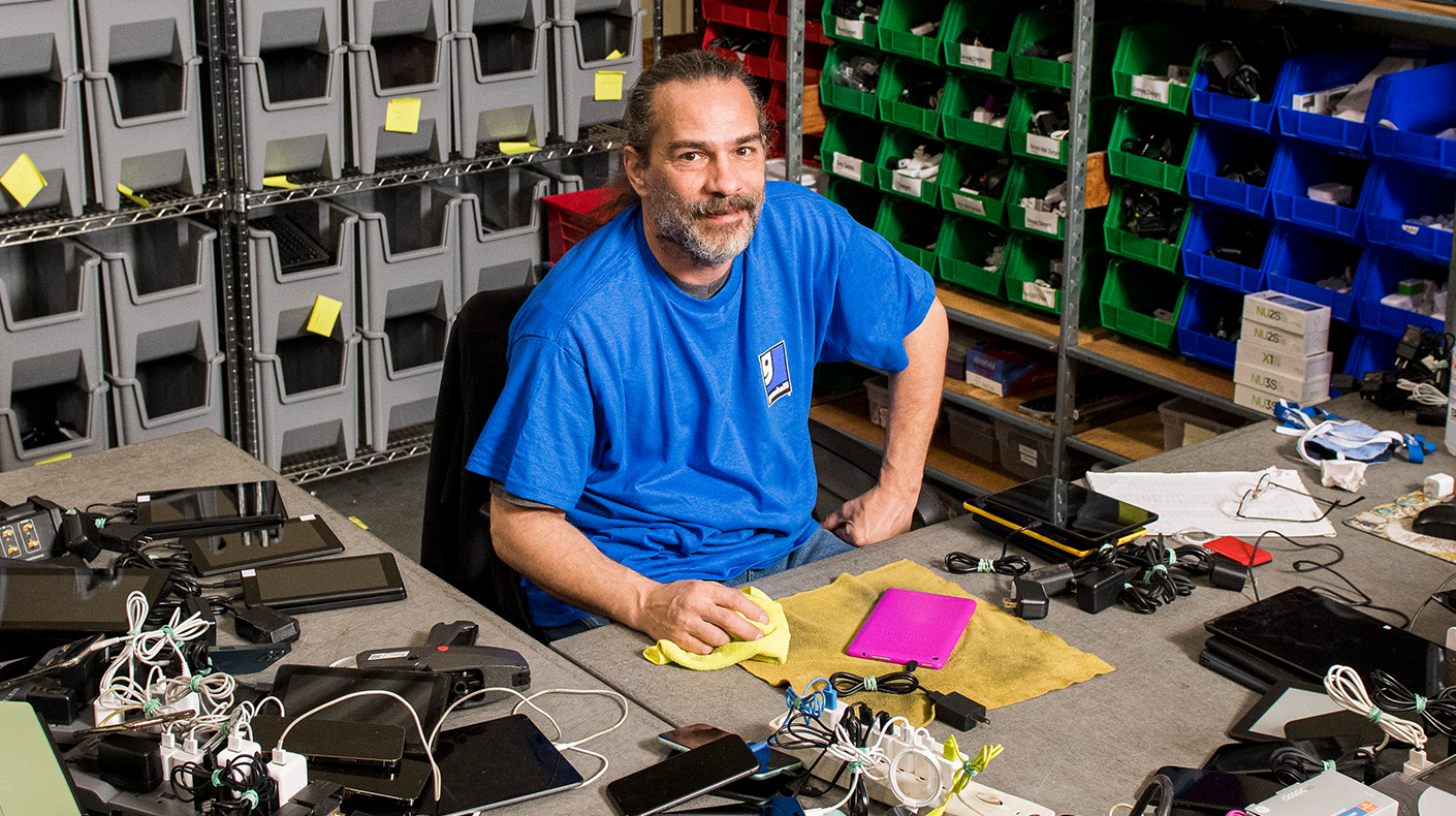 man recycling electronics