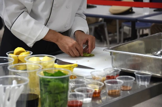 Goodwill great lakes chef preparing vegetables