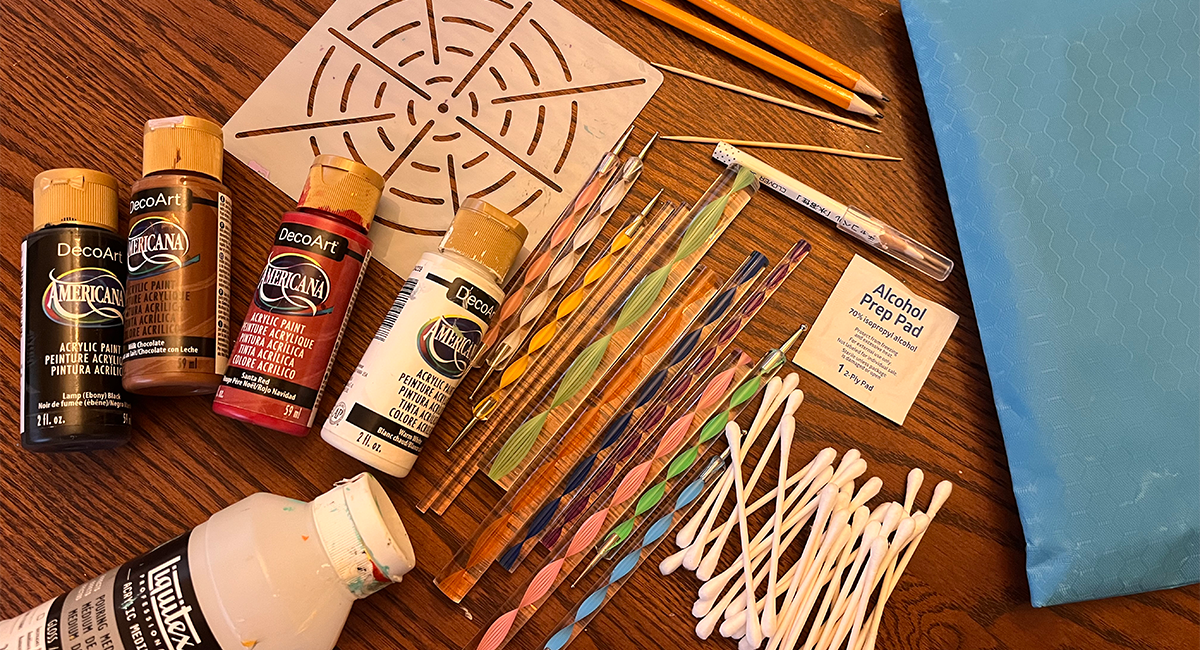 An assembly of different painting and crafting tools