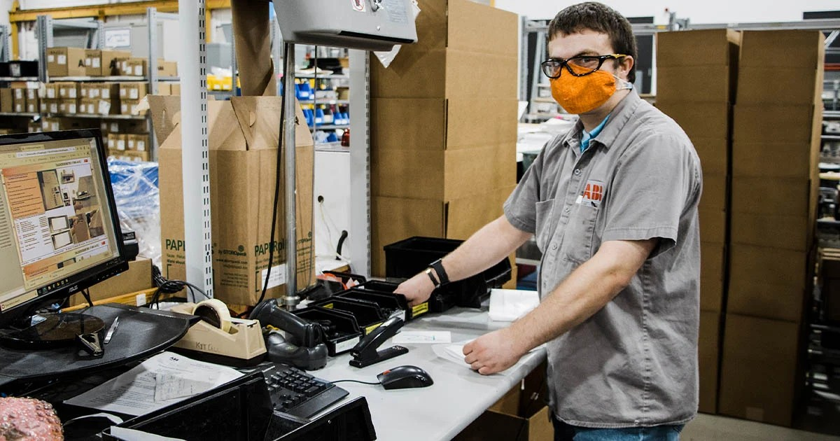 man in manufacturing job at desk