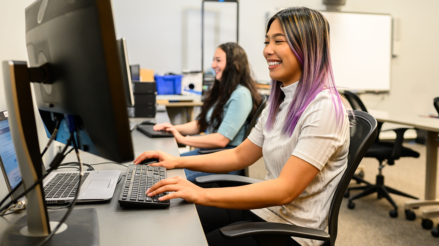 two women working at computers
