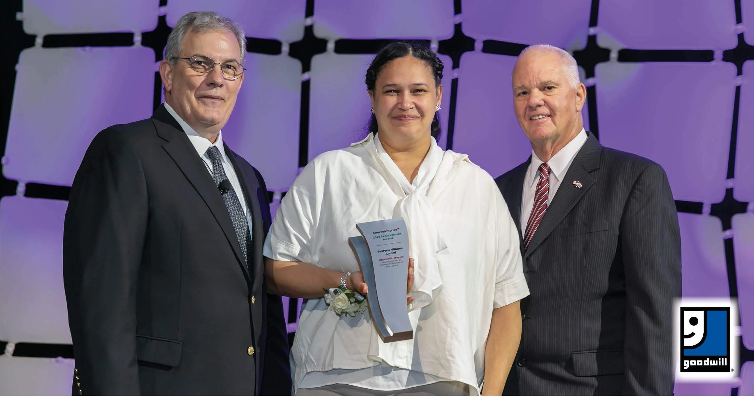 Goodwill great lakes employee receiving an award