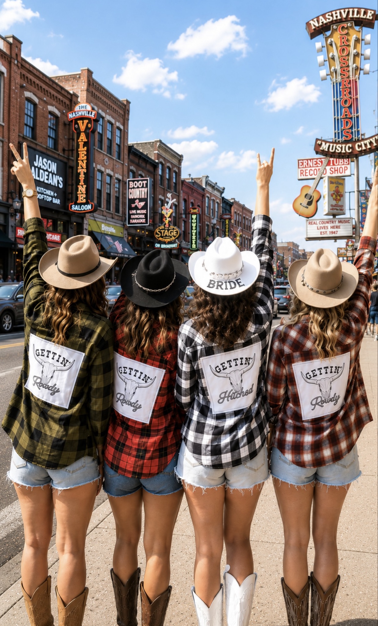 A bridal party posing with their backs to the camera with a city background