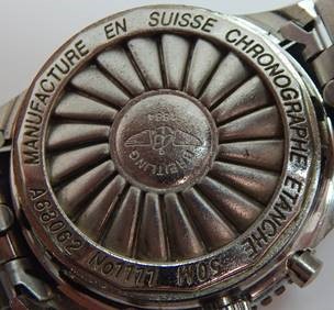 Back of a fake Breitling watch with irregular lettering
