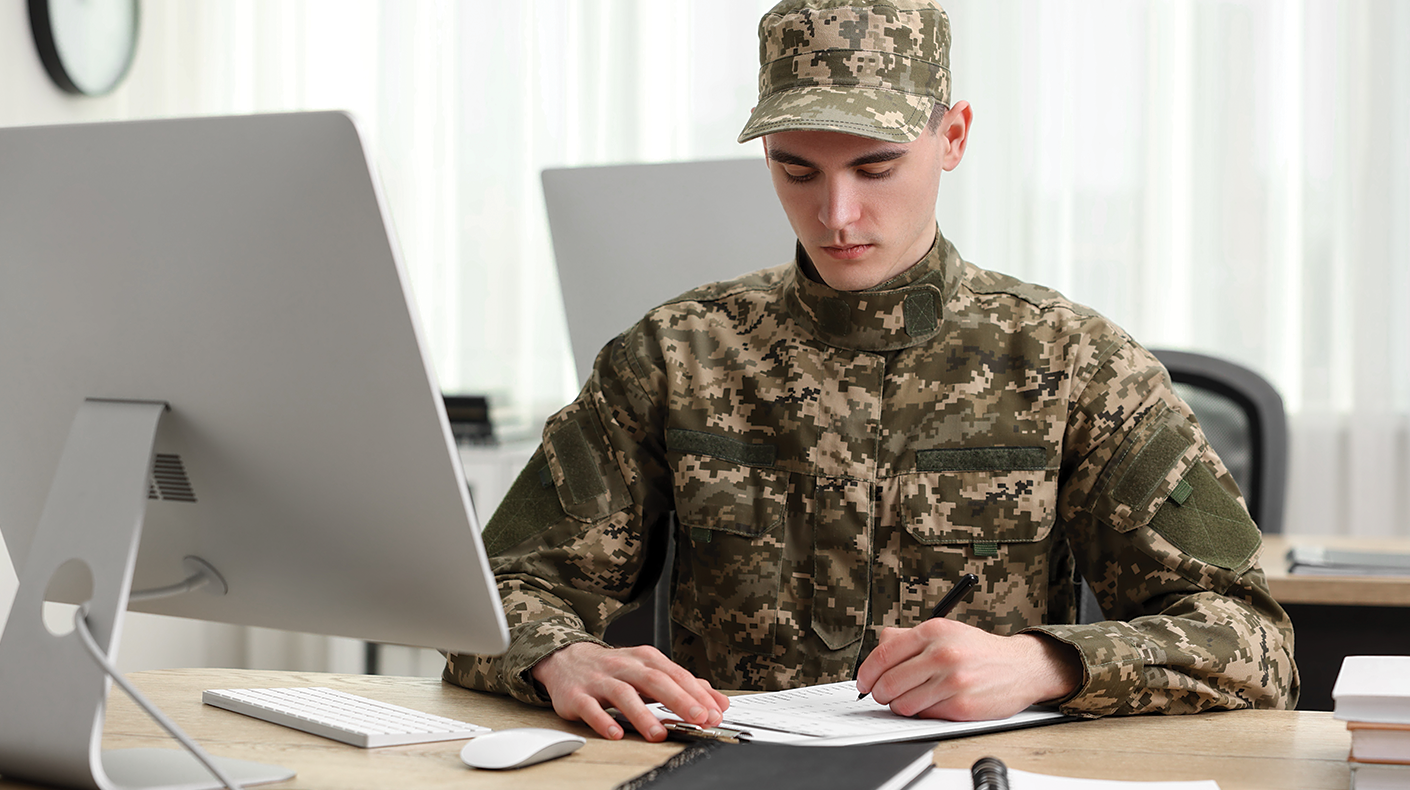 Military person writing a resume