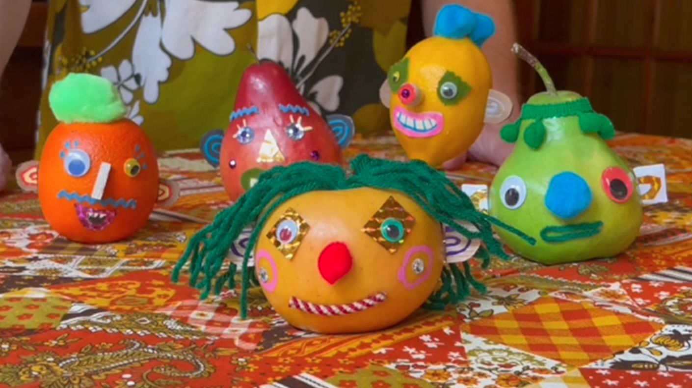 Plastic fruit upcycled to whimsical characters