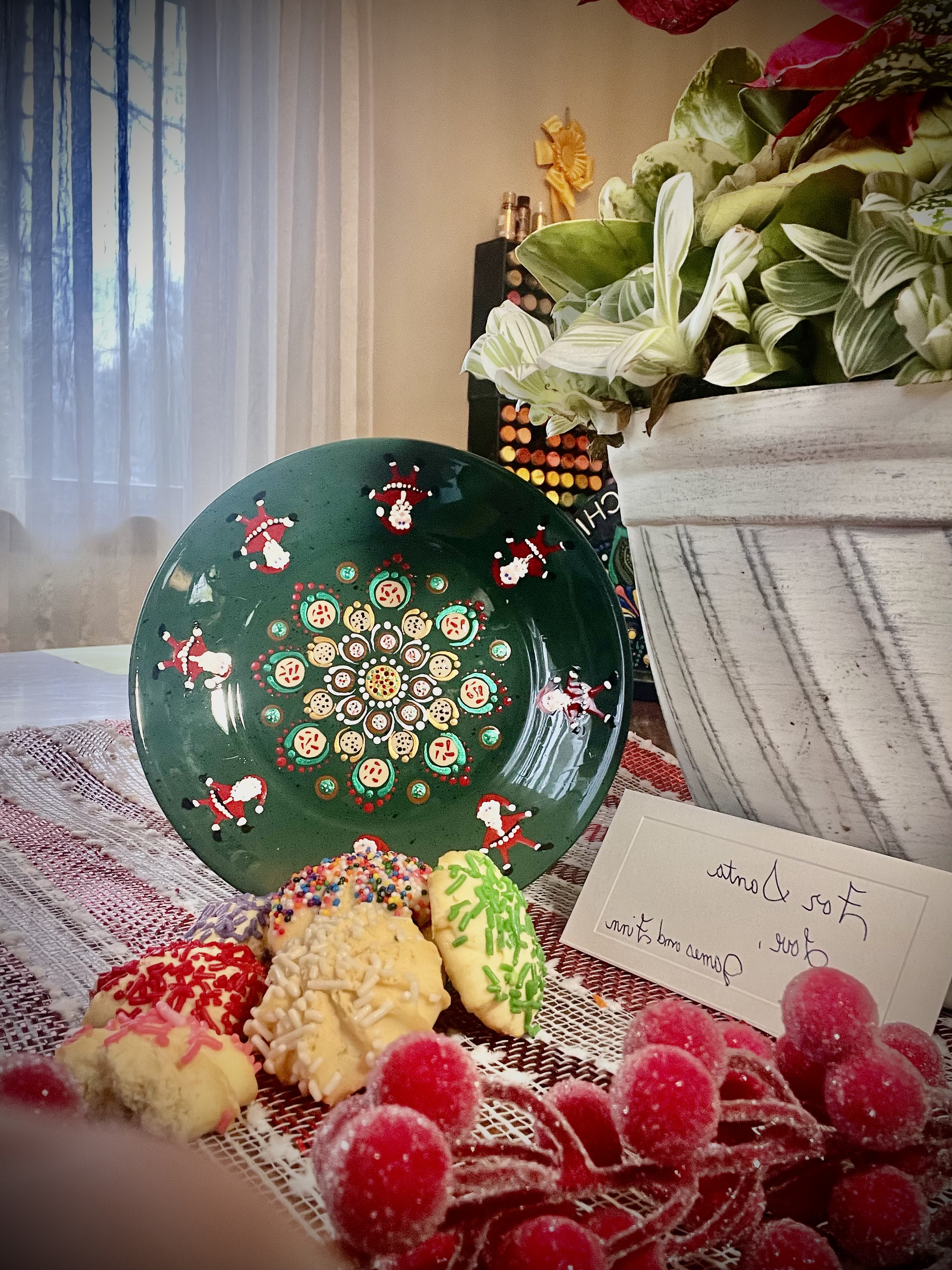 A finished craft assembled with cookies and holiday items