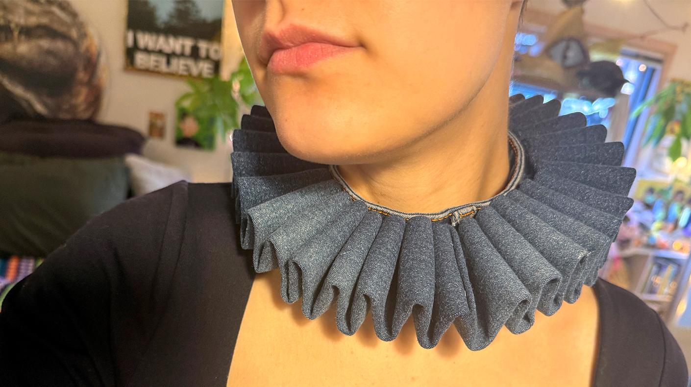 Person wearing a handmade neck ruff accessory