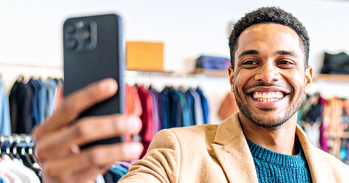 Man holding up a phone for a selfie