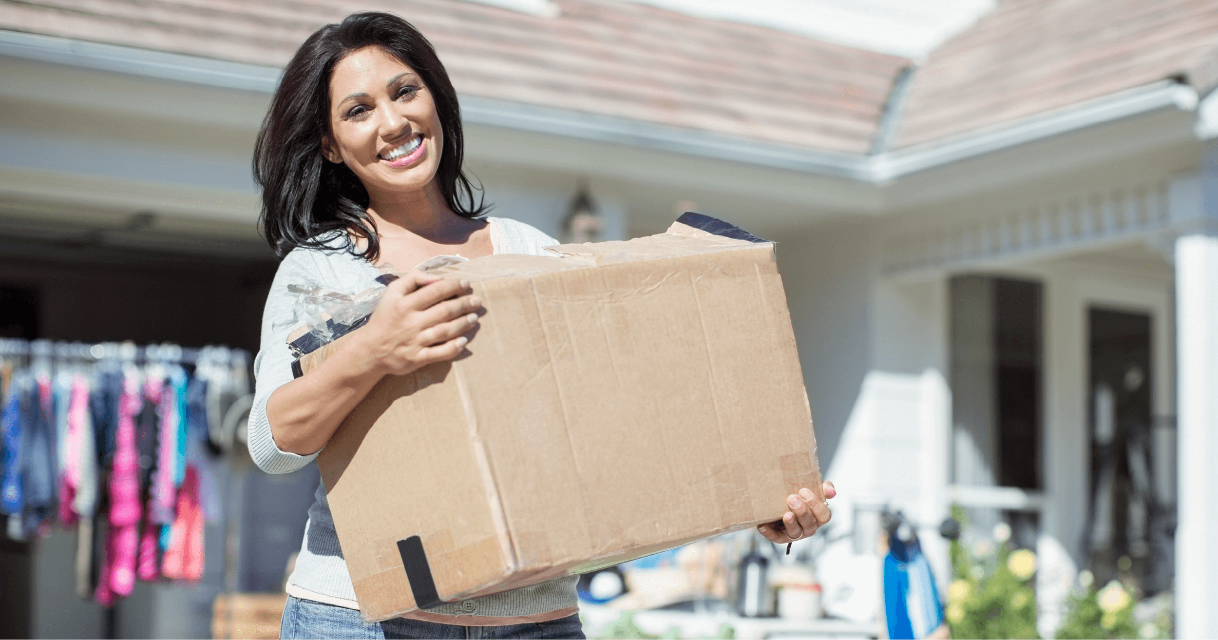 Garage Sale person carrying box